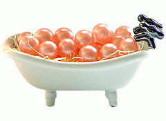 Pale Pink Round Bath Beads In Tub
