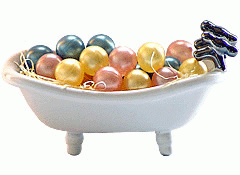 Three Pale Rounds Bath Beads In A Tub