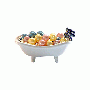 Image For: Three Pale Rounds Bath Beads In A Tub